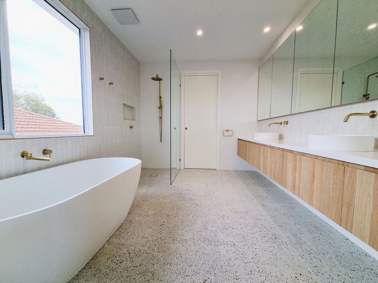 Bathroom with bath and vanity