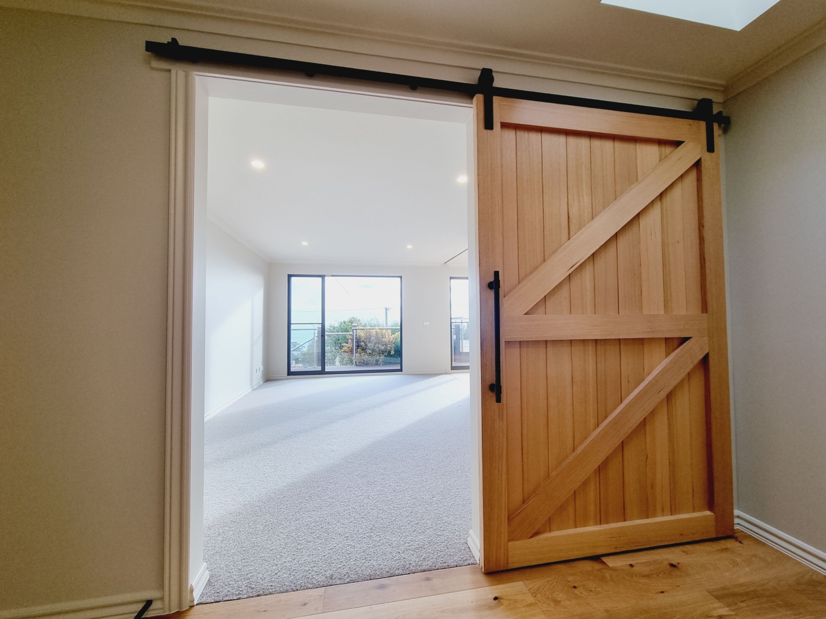 Wall hung sliding barn door