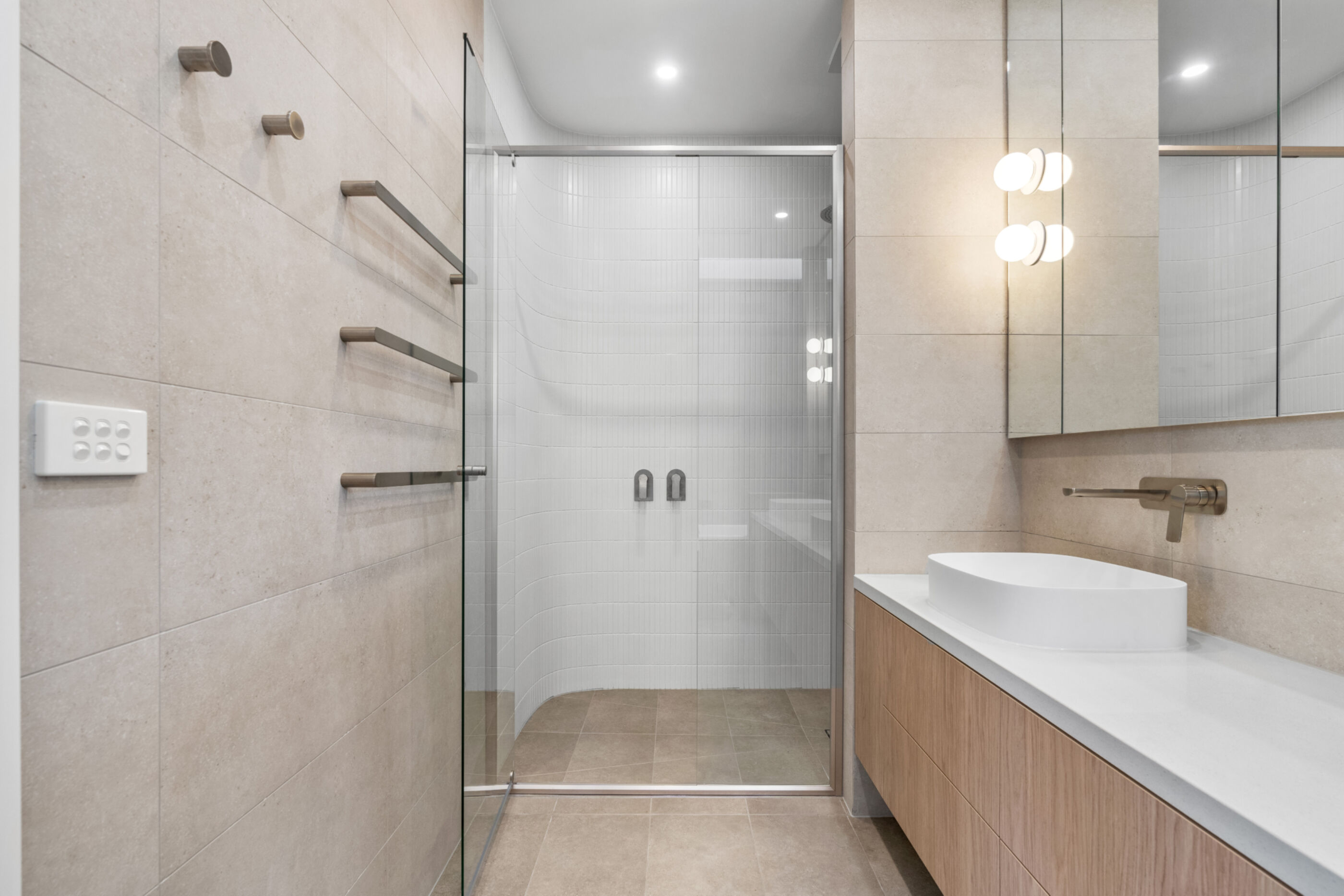 Towel rails and curved shower wall