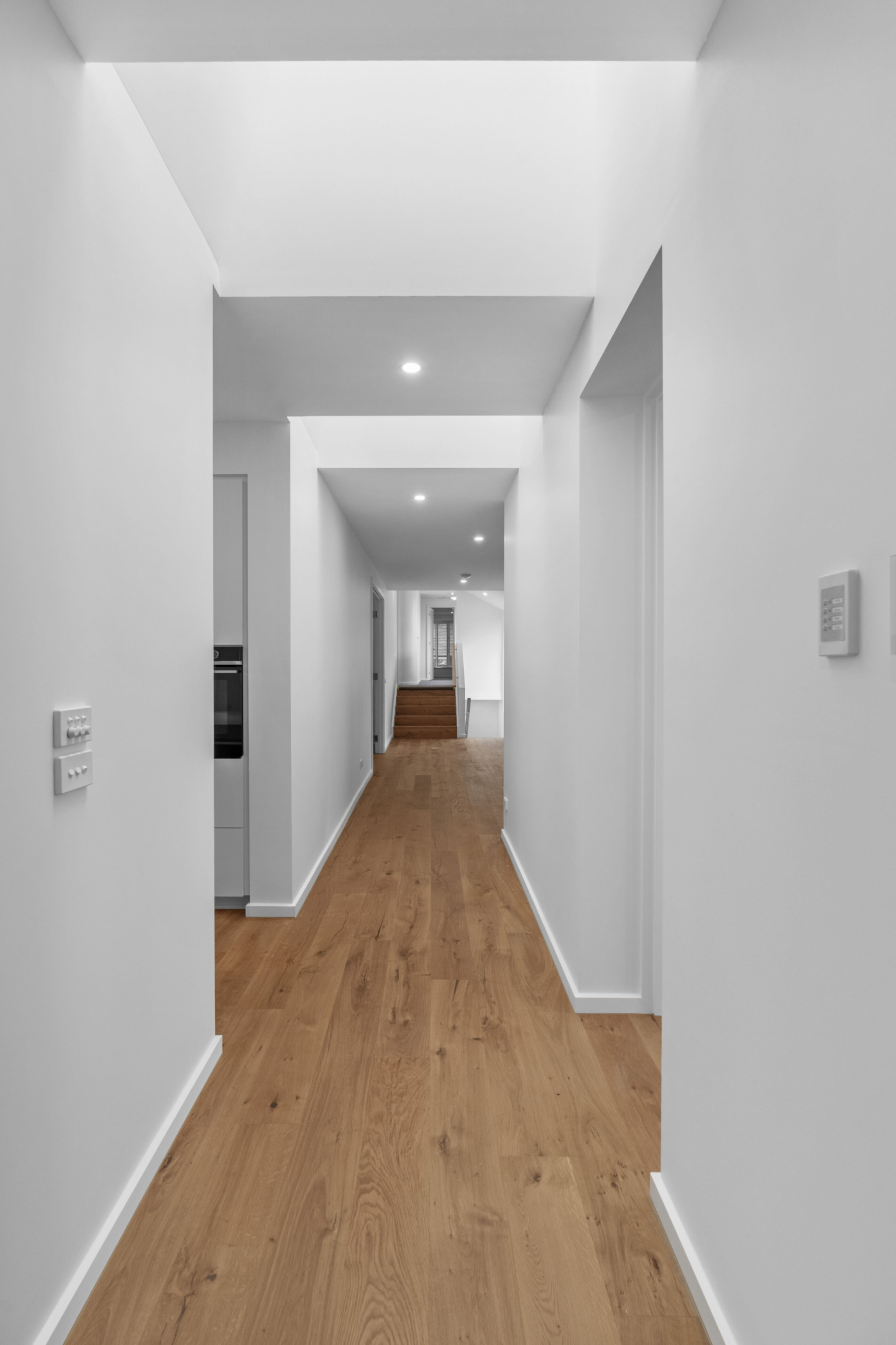 Hallway with timber floor and skylights