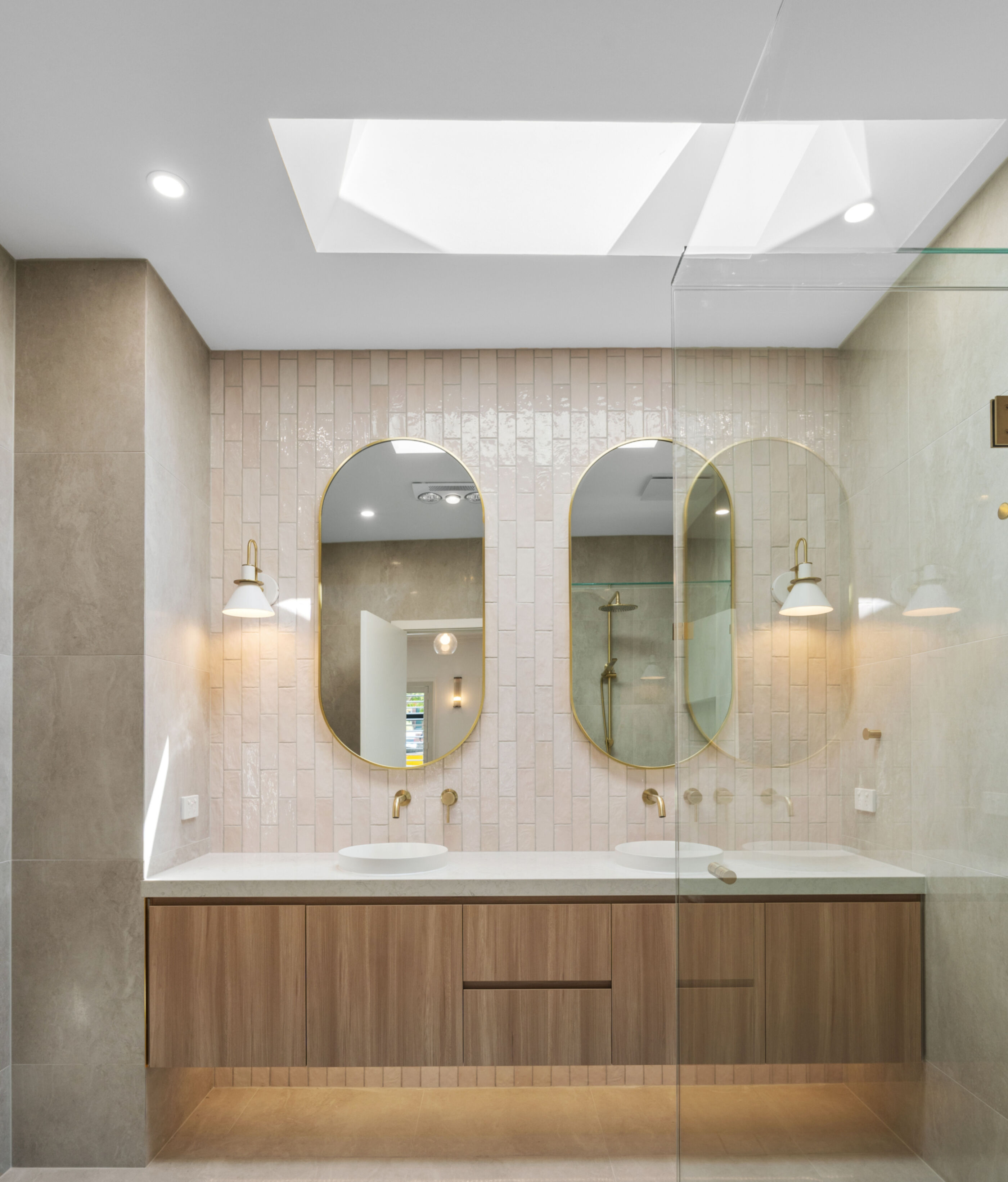 Ensuite with floating vanity and mirrors