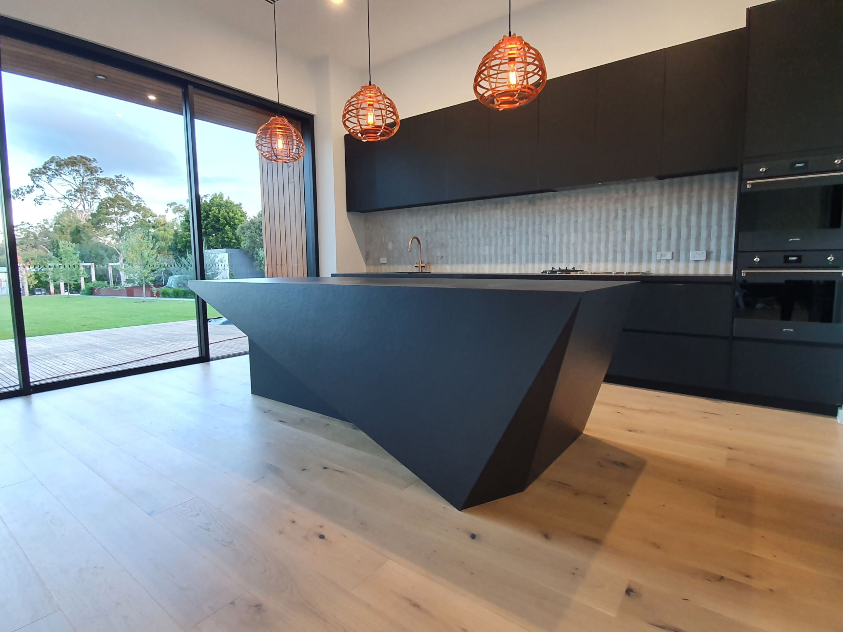 Black island bench with feature pendant lights